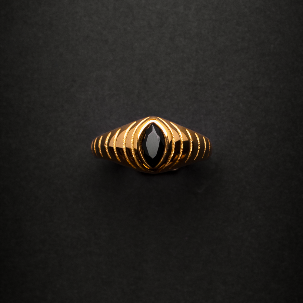 Gold ring with a black gemstone 